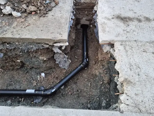 New pipe run taken through a concrete path and down into the ground