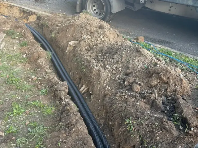 Duct laying for a new cable run at a Burger King drive-thru in Kent