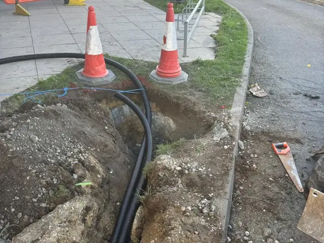Cable trench and ducting run across the forecourt of a Burger King drive-thru