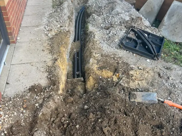 Installing a cable-draw chamber at a Burger King drive-thru in Kent