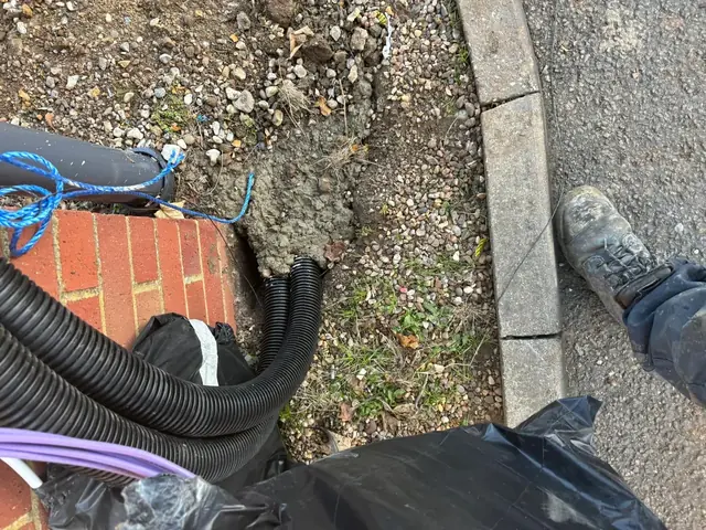 Cable ducting run into the ground at a Burger King drive-thru in Kent
