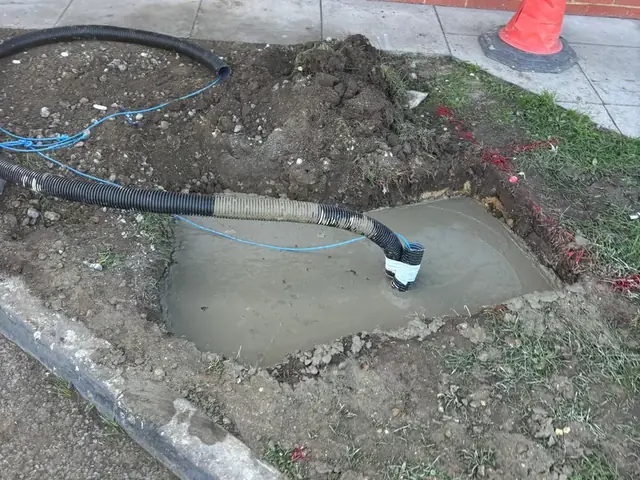Cable duct set into a concrete-surrounded chamber at a Burger King drive-thru