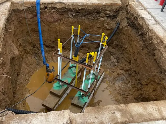 Steel cage set on shims over the ducting, ready to pour — Burger King sign base
