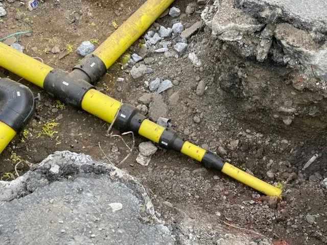 Yellow PE gas service pipe jointed and laid in a trench, Kent