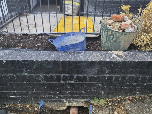 Old clay pipework exposed at the boundary wall during a customer supply renewal
