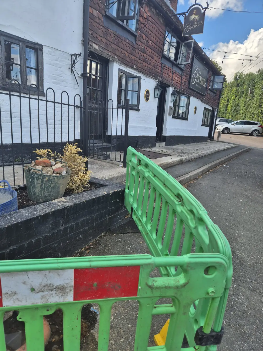 The pub in West Malling with the excavation barriered off out front The pub in West Malling with the excavation barriered off out front
