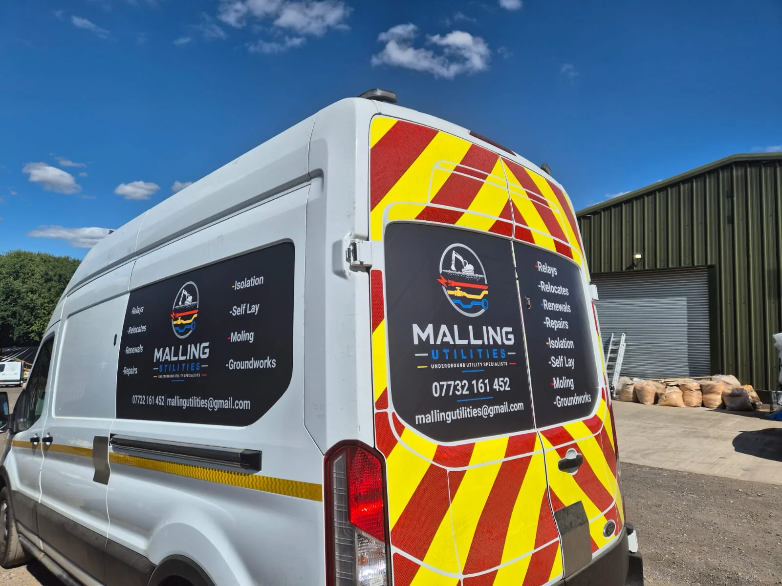 A signwritten Malling Utilities van with Chapter 8 chevrons, listing relays, relocates, renewals, repairs, isolation, self-lay, moling and groundworks